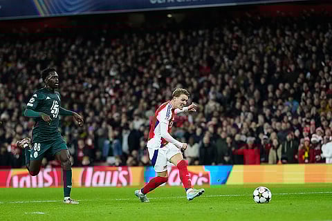 UEFA Champions League: Arsenal's Martin Odegaard, right, misses an opportunity to score