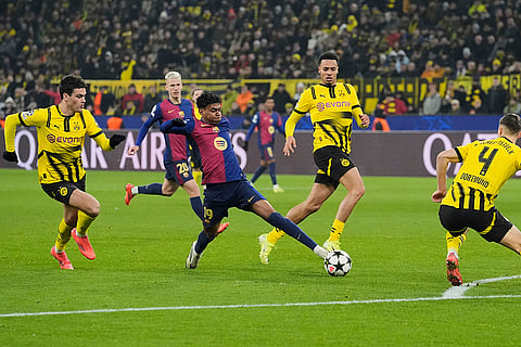 UEFA Champions League: Barcelona's Lamine Yamal fights for the ball against Dortmund's Nico Schlotterbeck