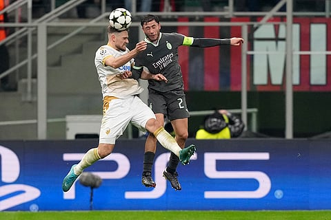 UEFA Champions League: AC Milan's Davide Calabria, right, challenges Red Star's Timi Max Elsnik