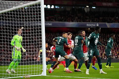 UEFA Champions League: Monaco's Vanderson, second right, challenges with Arsenal's Jakub Kiwior