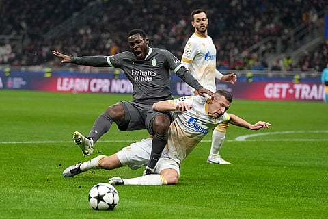 UEFA Champions League: Red Star's Uros Spajic, right, challenges AC Milan's Yunus Musah