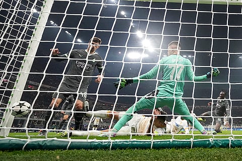 UEFA Champions League: AC Milan's Tammy Abraham, right, scores his sides second goal past Red Star's goalkeeper Ivan Gutesa