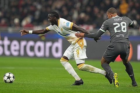 UEFA Champions League: AC Milan's Malick Thiaw, right, challenges Red Star's Cherif Ndiaye