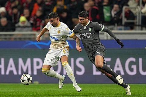 UEFA Champions League: AC Milan's Alvaro Morata, right, challenges Red Star's Rade Krunic
