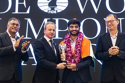 World Chess Championship 2024: Gukesh holding the trophy