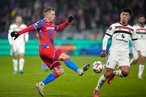 UEFA Europa League: Plzen's Matej Vydra, left, challenges for the ball with Man United's Lisandro Martinez