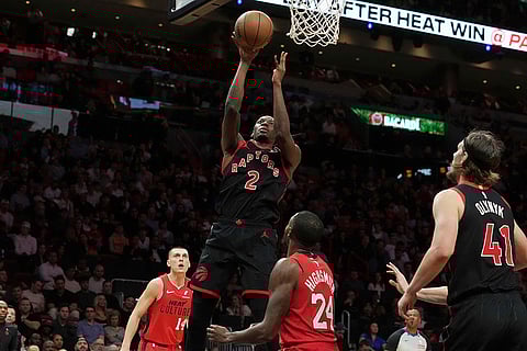 NBA: Raptors forward Jonathan Mogbo (2) drives to the basket
