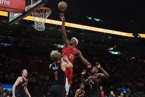 NBA: Heat forward Jimmy Butler drives to the basket as Raptors guard Gradey Dick