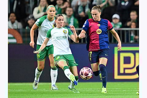 Women's Champions League: Hammarby's Smilla Vallotto, left, and Barcelona's Ewa Pajor