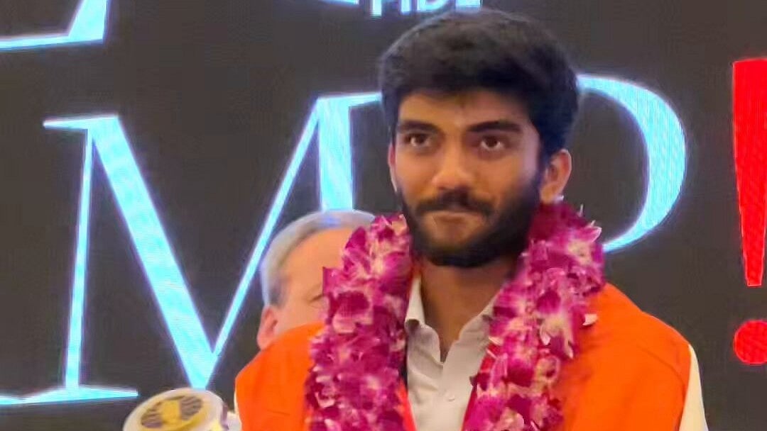 X/International Chess Federation : D Gukesh lifts the FIDE World Chess Championship trophy in Singapore on Friday (December 13, 2024).