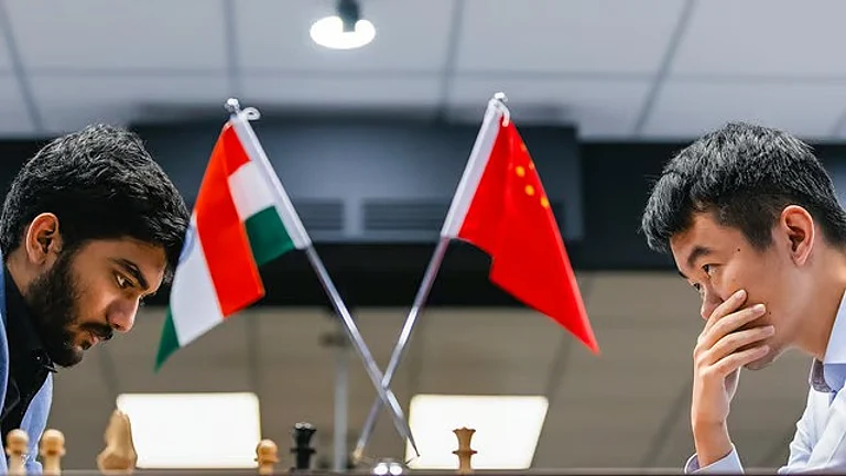 India's D Gukesh and China’s Ding Liren during the 14th game of the FIDE World Chess Championship 2024, in Singapore. - FIDE/Eng Chin An via PTI