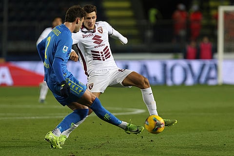Serie A 2024-25: Torino's Gvidas Gineitis and Empoli's Saba Goglichidze in action