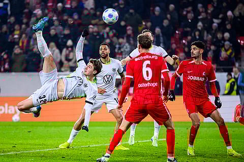 Bundesliga 2024-25: Wolfsburg's Mattias Svanberg left, scores a goal