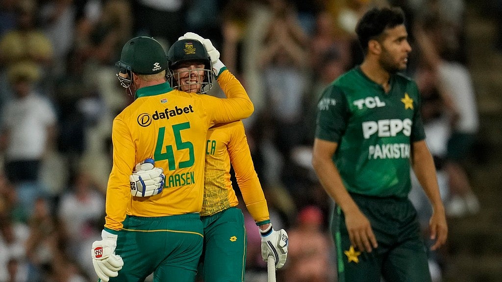 AP/Themba Hadebe : South Africa's Rassie van der Dussen, centre, celebrates with Heinrich Klaasen after scoring to win the second T20 International cricket match between South Africa and Pakistan, at Centurion Park in Centurion, South Africa, Friday, Dec. 13, 2024