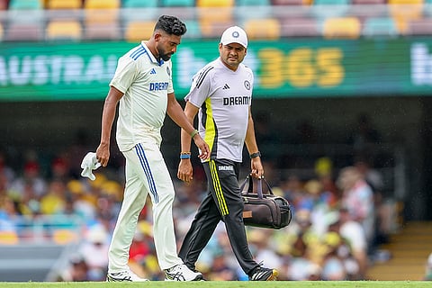 India Vs Australia, 3rd Test Day 2: India's Mohammed Siraj, left, walks off the field after an injury