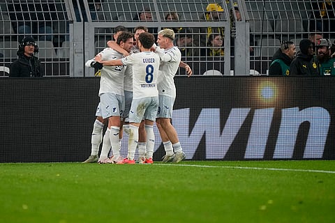 Bundesliga 2024-25: Hoffenheim's Jacob Bruun Larsen, left, celebrates with teammates after scoring his side's first goal