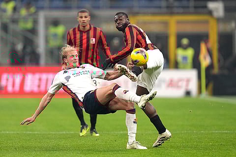 Serie A 2024-25: Genoa's Morten Thorsby challenges for the ball with AC Milan's Youssouf Fofana