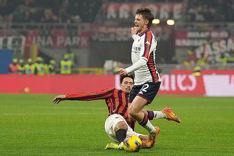 Serie A 2024-25: AC Milan's Tijjani Reijnders challenges for the ball with Genoa's Morten Frendrup