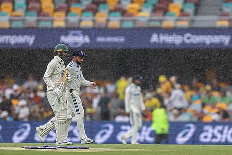 India Vs Australia, 3rd Test Day 3: Australia's Alex Carey, left, and India's Virat Kohli lleaves the field as it rains