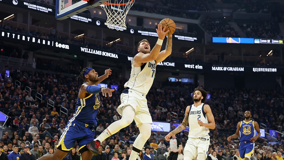Luka Doncic's triple-double helped the Dallas Mavericks beat the Golden State Warriors. - null