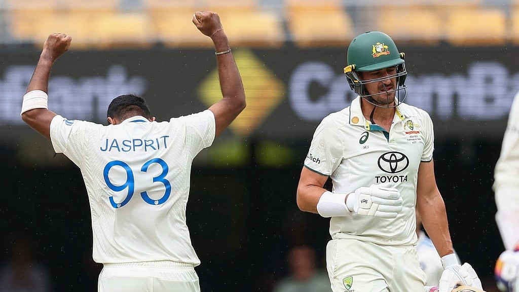 India's Jasprit Bumrah, left, celebrates after dismissing Australia's Mitchell Starc, right, during play on day three of the third cricket test between India and Australia at the Gabba in Brisbane, Australia, Monday, Dec. 16, 2024.


 - AP/Pat Hoelscher