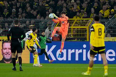 Bundesliga 2024-25: Dortmund's goalkeeper Gregor Kobel jumps to grab the ball