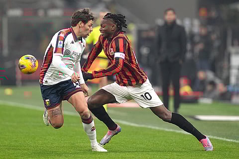 Serie A 2024-25: AC Milan's Rafael Leao, right, challenges for the ball with Genoa's Alessandro Vogliacco
