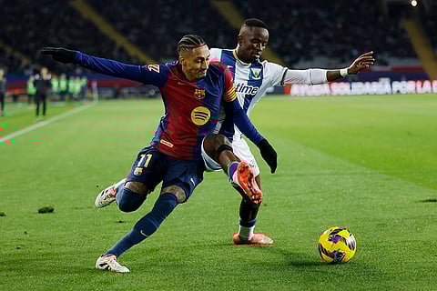 La liga 2024-25: Barcelona's Raphinha, left, and Leganes' Seydouba Cisse challenge for the ball