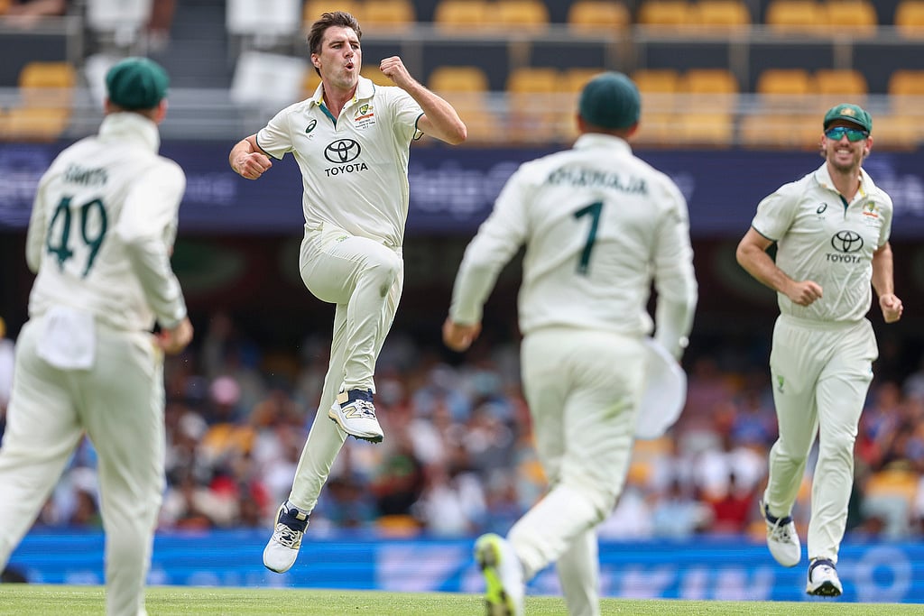 AP/Pat Hoelscher : Australia's captain Pat Cummins, second left, celebrates with teammates after the dismissal of India's Rishabh Pant during play on day three of the third cricket test between India and Australia at the Gabba in Brisbane, Australia, Monday, Dec. 16, 2024.


