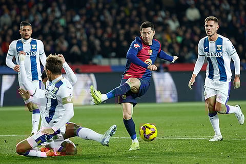 La liga 2024-25: Barcelona's Robert Lewandowski, centre, shoots the ball