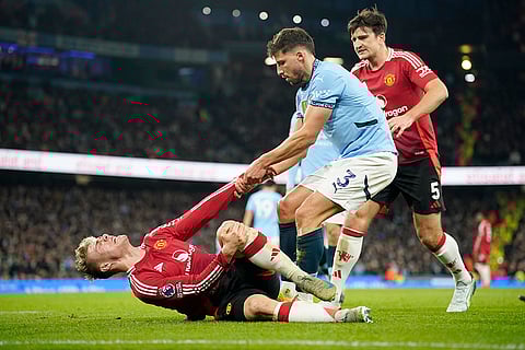 EPL 2024-25: Manchester City's Ruben Dias assists Manchester United's Rasmus Hojlund