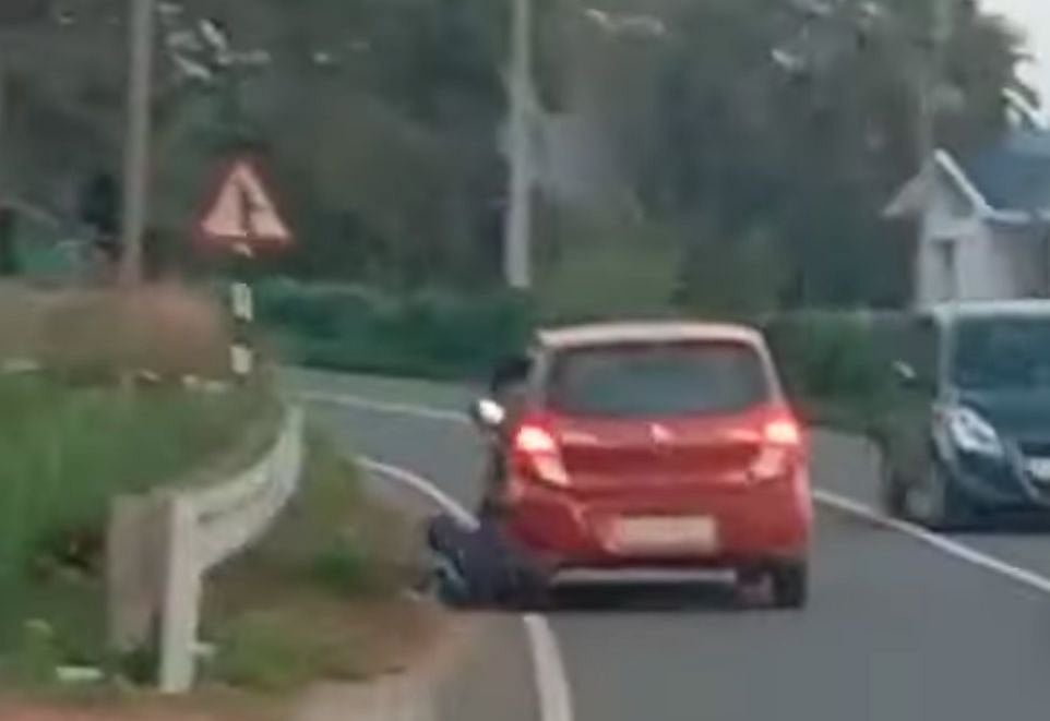 Screengrab via YouTube : Tourists Drag Tribal Man By Car In Kerala's Wayanad
