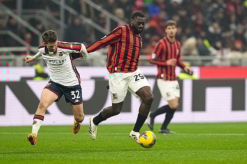 Serie A 2024-25: Genoa's Morten Frendrup challenges for the ball with AC Milan's Youssouf Fofana