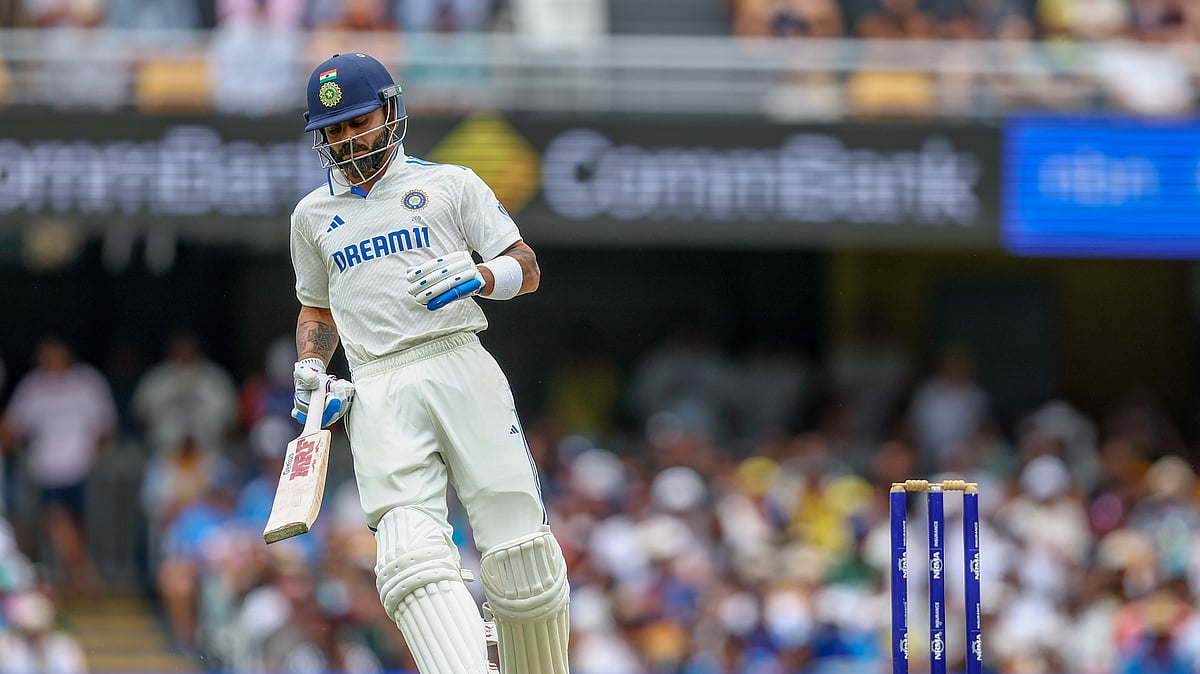 Indias Virat Kohli run between the wickets to score during the Gabba Test. AP Photo