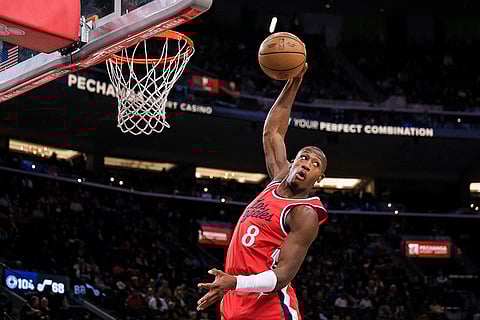 NBA 2024-25: Clippers guard Kris Dunn (8) rebounds the ball