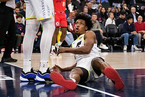 NBA 2024-25: Jazz guard Collin Sexton reacts after getting fouled 