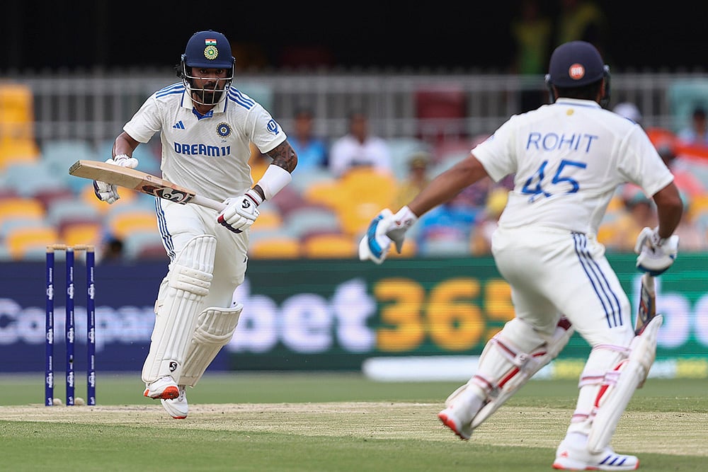 | Photo: AP/Pat Hoelscher : India Vs Australia, 3rd Test Day 4: India's KL Rahul and Rohit Sharma run between the wickets