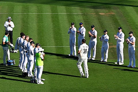 A guard of honor is formed by the England players as Tim Southee walks out to bat in his final test match
