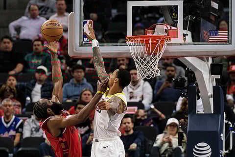 NBA 2024-25: Clippers guard James Harden, left, shoots the ball while Jazz forward John Collins