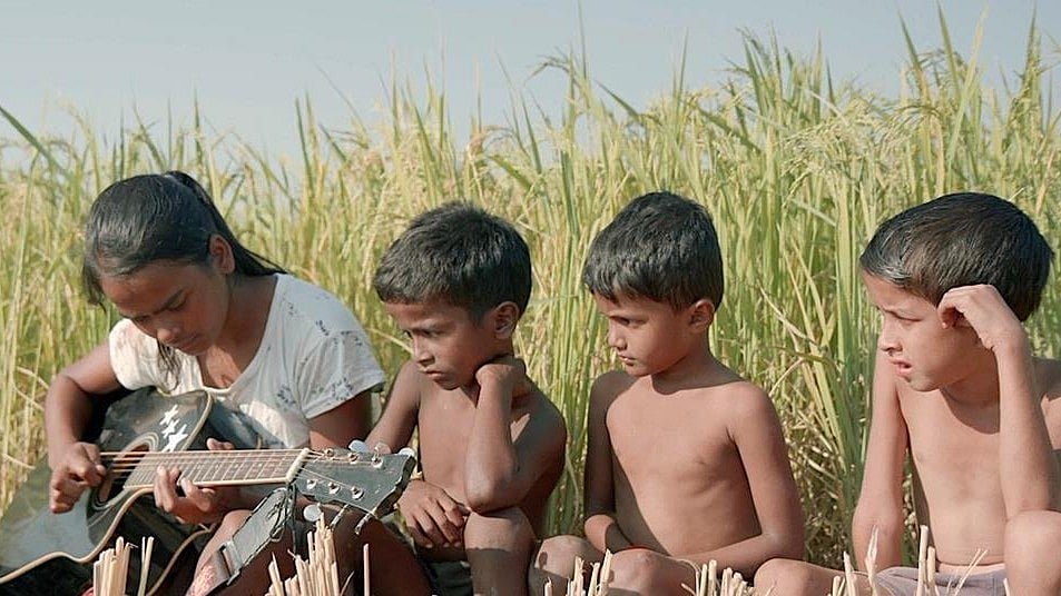 X : A still from Village Rockstars 2
