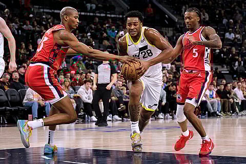 NBA 2024-25: Clippers forward Kai Jones knocks the ball from Jazz forward Brice Sensabaugh