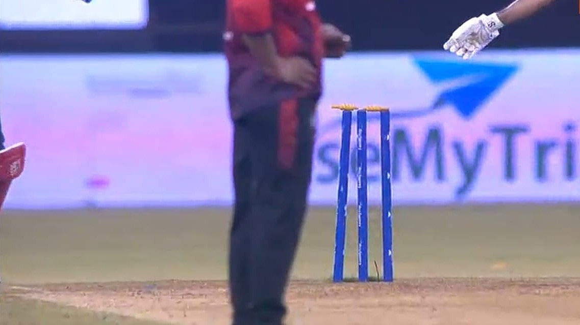 Screengrab/FanCode : Chirag Gandhi's stumps that were not dislodged despite the ball hitting the stumps.