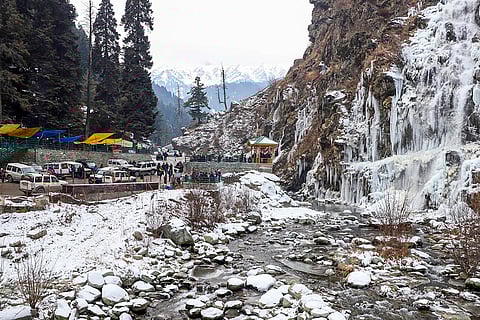 Cold wave in Kashmir valley: Tourists visit a frozen waterfall at Drung