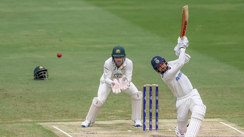 AP Photo/Pat Hoelscher : India's Akash Deep plays a shot during play on day five of the third cricket test between India and Australia at the Gabba in Brisbane, Australia, Wednesday, Dec. 18, 2024.


