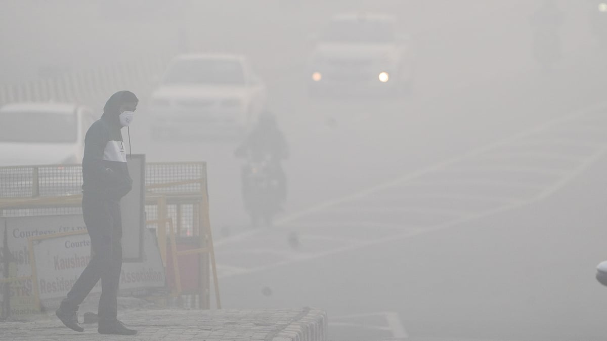 PTI : A man crosses a road amid dense fog in New Delhi, Wednesday, Dec. 18, 2024.