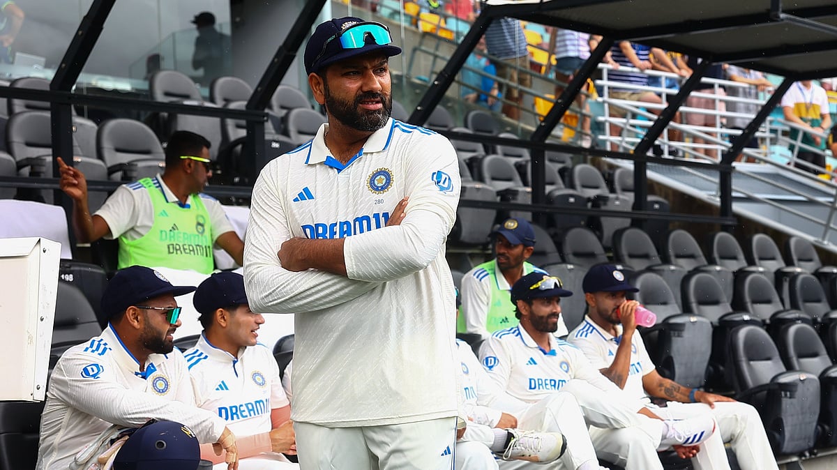 File  : India's captain Rohit Sharma waits for play to start on day three of the third cricket test between India and Australia at the Gabba in Brisbane.