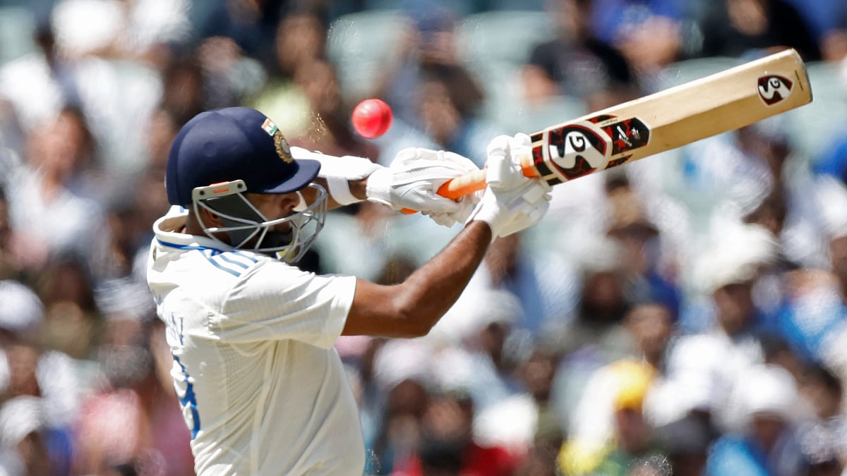 AP Photo/James Elsby : India's Ravichandran Ashwin plays a shot to be caught behind by Australia's wicketkeeper Alex Carey during day three of the second cricket test match between Australia and India at the Adelaide Oval in Adelaide.