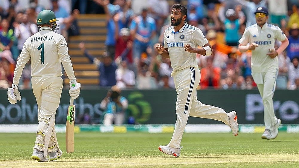 Photo: AP/Pat Hoelscher : Australia vs India: Jasprit Bumrah removes Usman Khawaja in Brisbane.