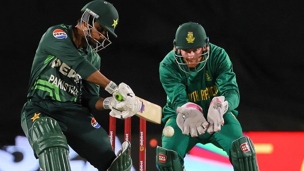 AP : Saim Ayub in action while South Africa wicketkeeper Heinrich Klaasen watches on during the first ODI match.