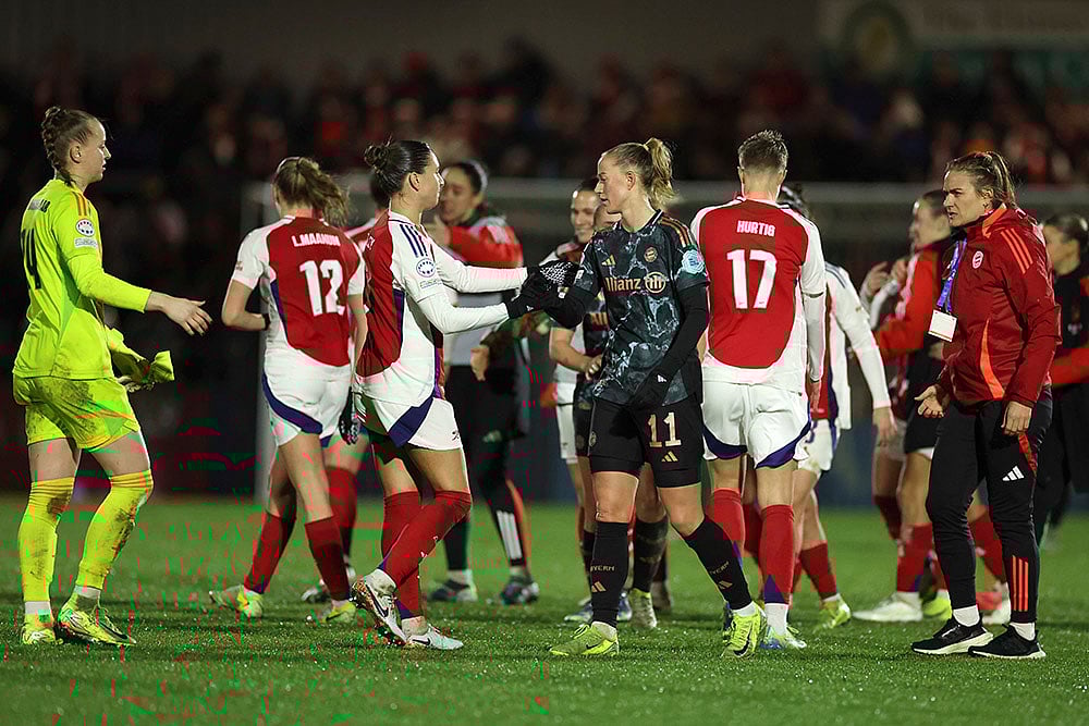 | Photo: AP/Ian Walton : Women's Champions League: Arsenal's Steph Catley, centre left, shakes hands with Bayern Munich's Lea Schuller 